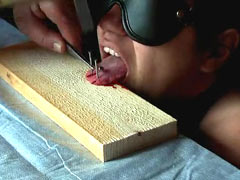 Tongue nailed to board